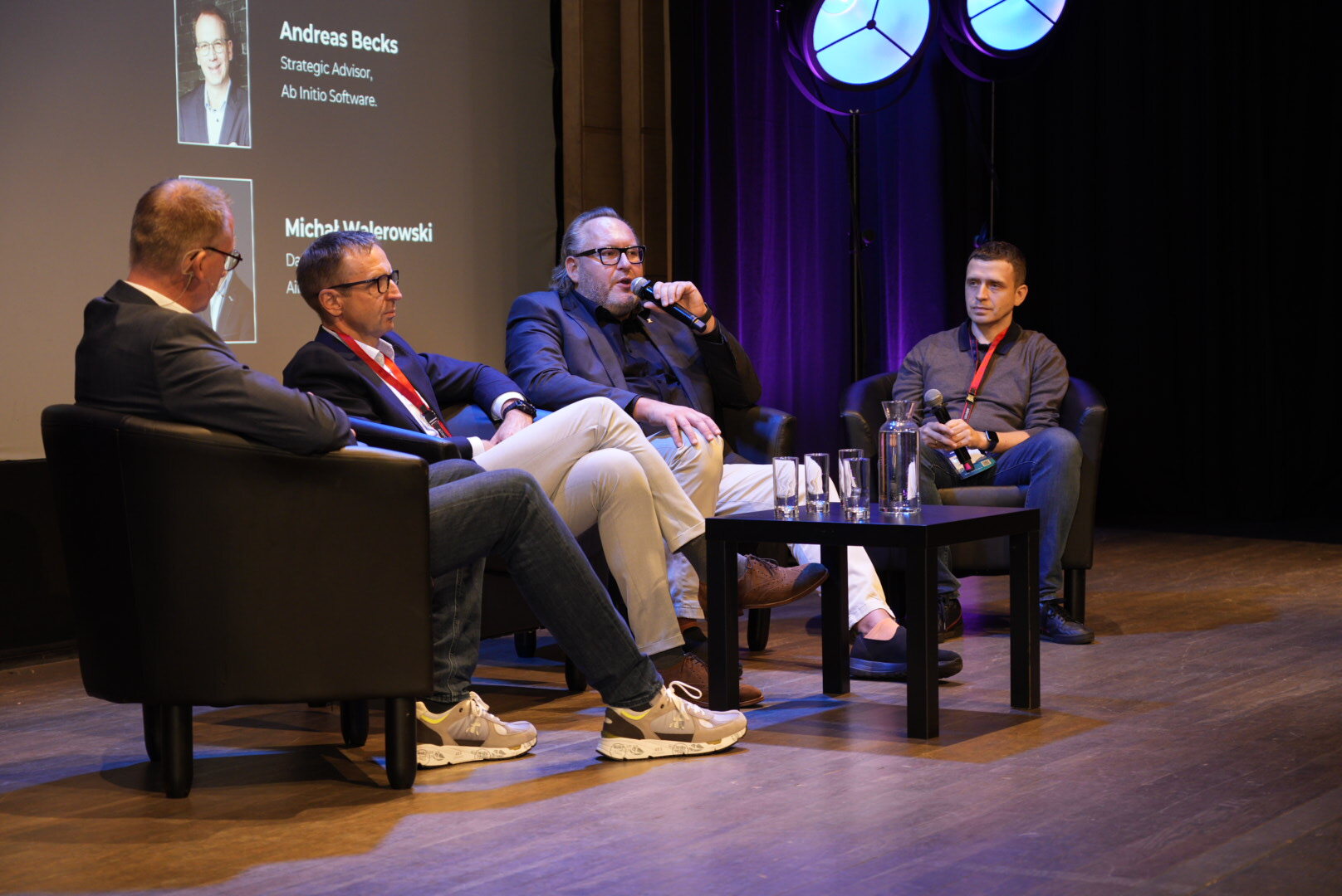 Damian_Ragan__Bartłomiej_Nocoń__Andreas_Becks_and_Michał_Walerowski_speaking_on__Navigating_the_AI_Wave___Panel_Discussion__790c9f4c