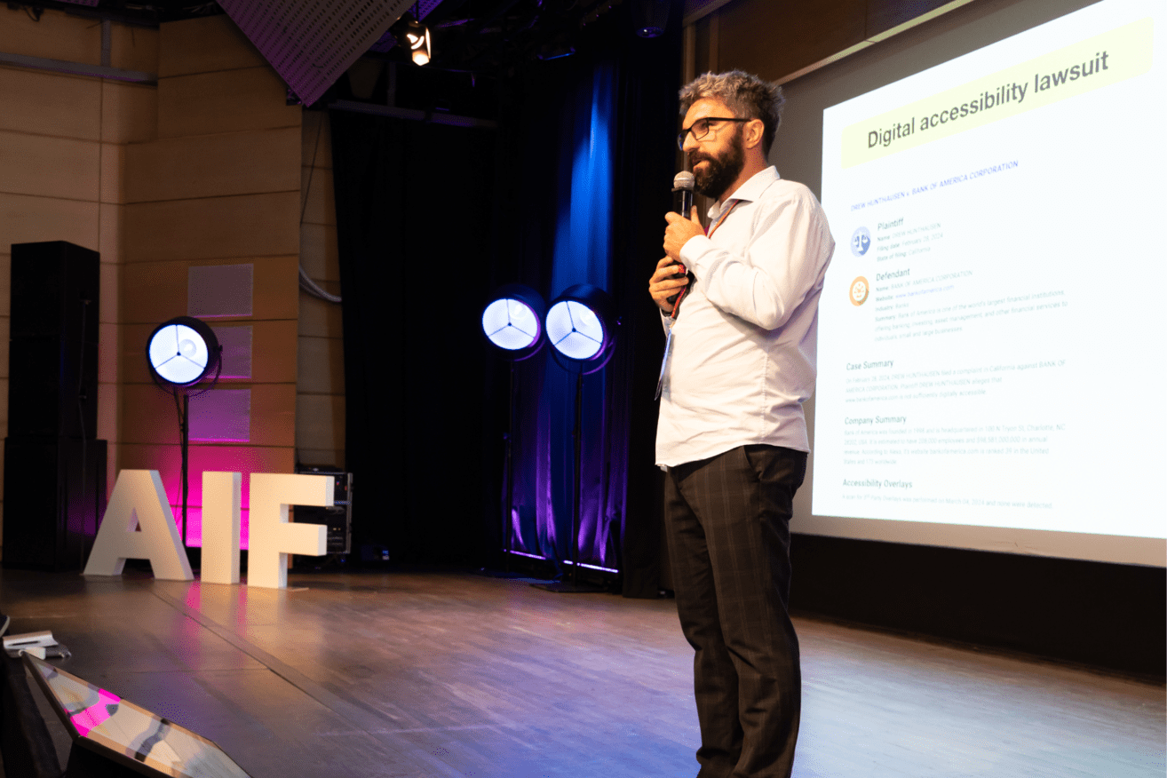 Piotr_Zrolka__CEO___UX_Designer___Strategist___Accessibility_Expert_at_Kinaole__leading_a_keynote_speech_during_Ailleron_Innovation_Forum_2024_fintech_conference